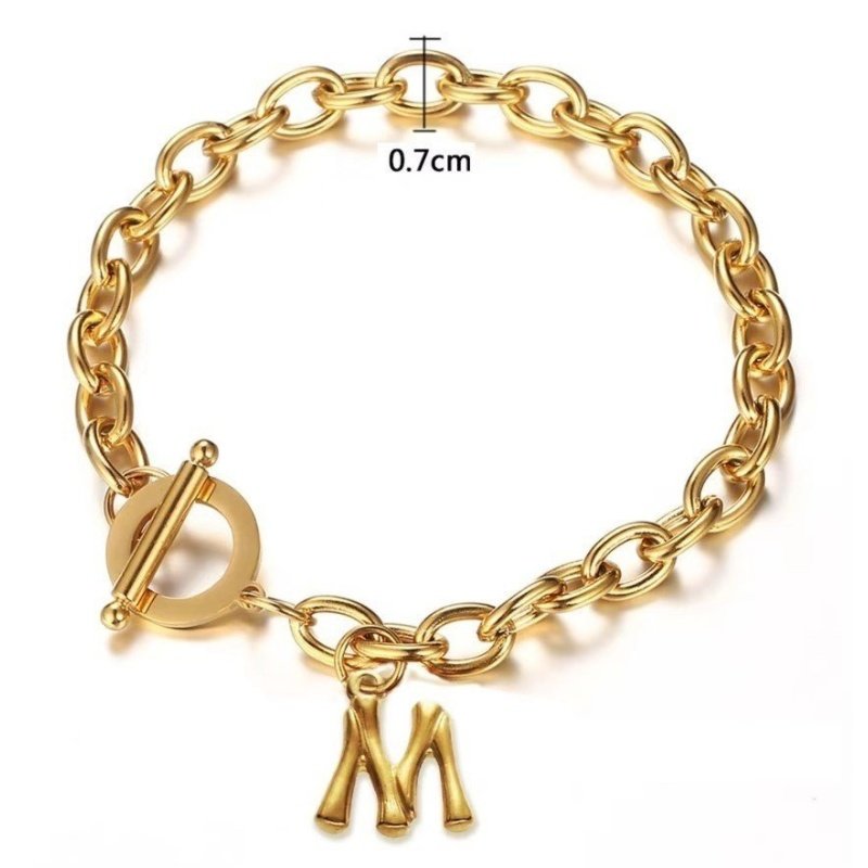 PULSERA CON INICIAL ACERO Y ORO ALTA CALIDAD