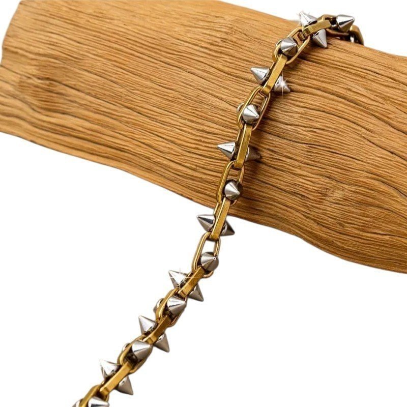 PULSERA PINCHOS ACERO Y ORO