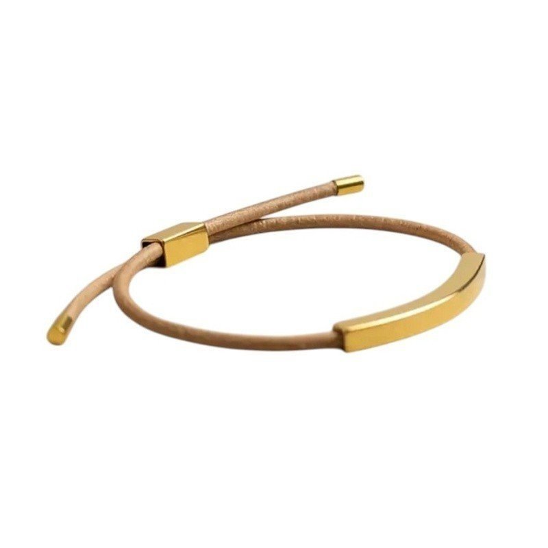 ESCLAVA FINA DE CUERO NATURAL Y ACERO ORO