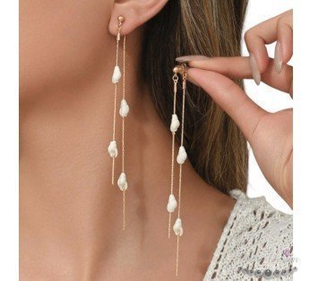 pendientes largos caracolas marinas acero y oro