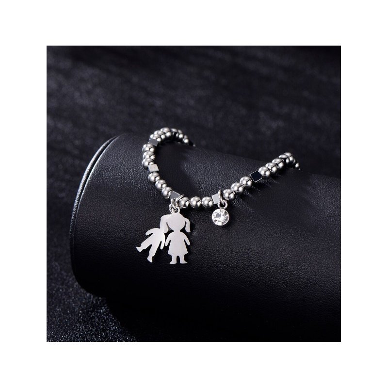 PULSERA CON NIÑOS COLGANTES